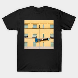 Laundry Drying on Washing Line Against Yellow Building Facade in Italy T-Shirt